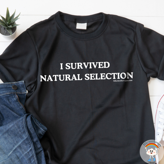 Close up of the black "I Survived Natual Selection" funny cancer t-shirt, chronic illness shirt, & spoonie tee from Mhemotherapy.
